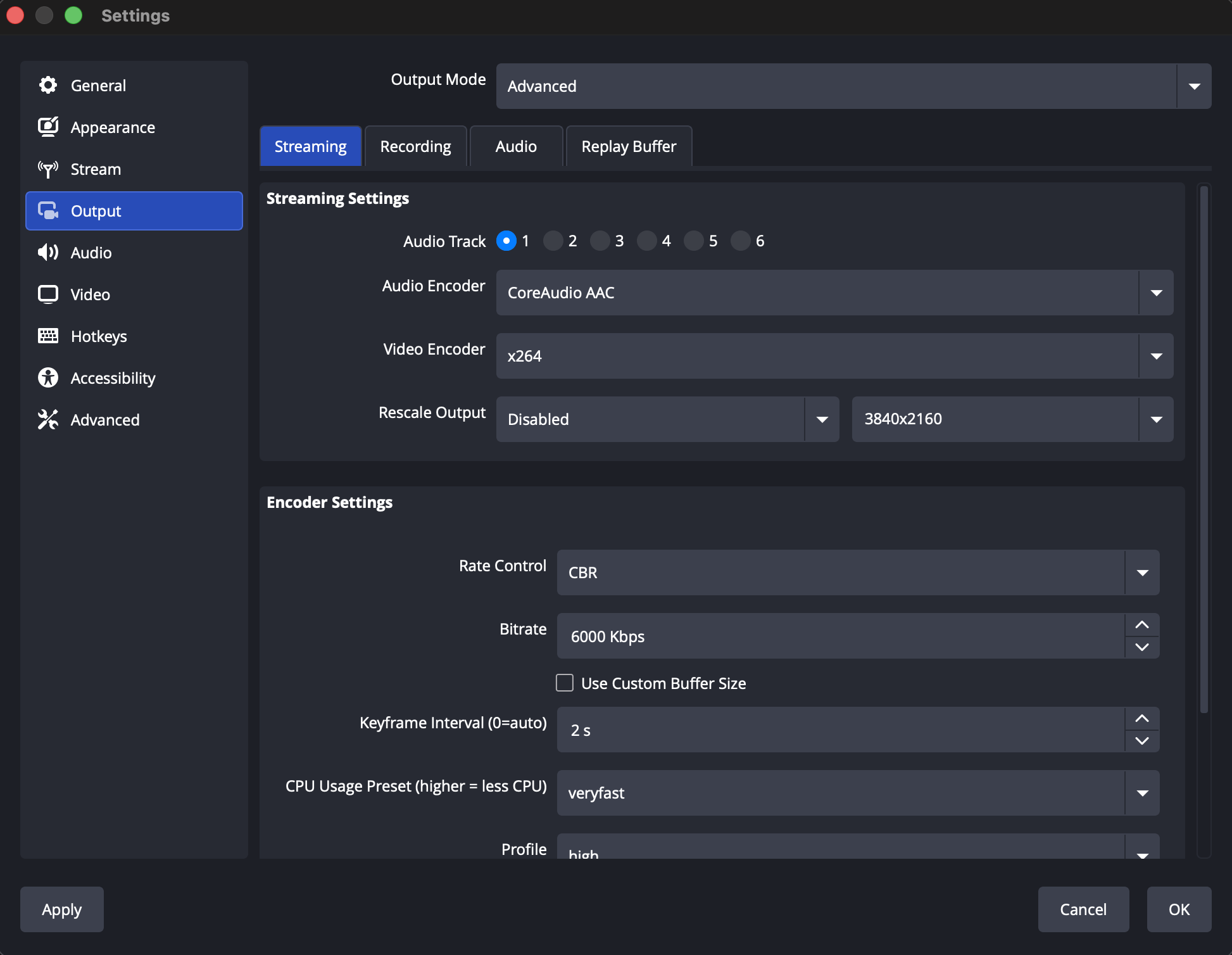 The OBS Settings window open to the Output section in Advanced mode, showing the Streaming tab with the encoder and bitrate settings